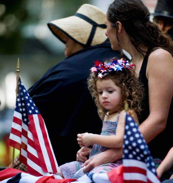 Girl and mother in parade, 2013